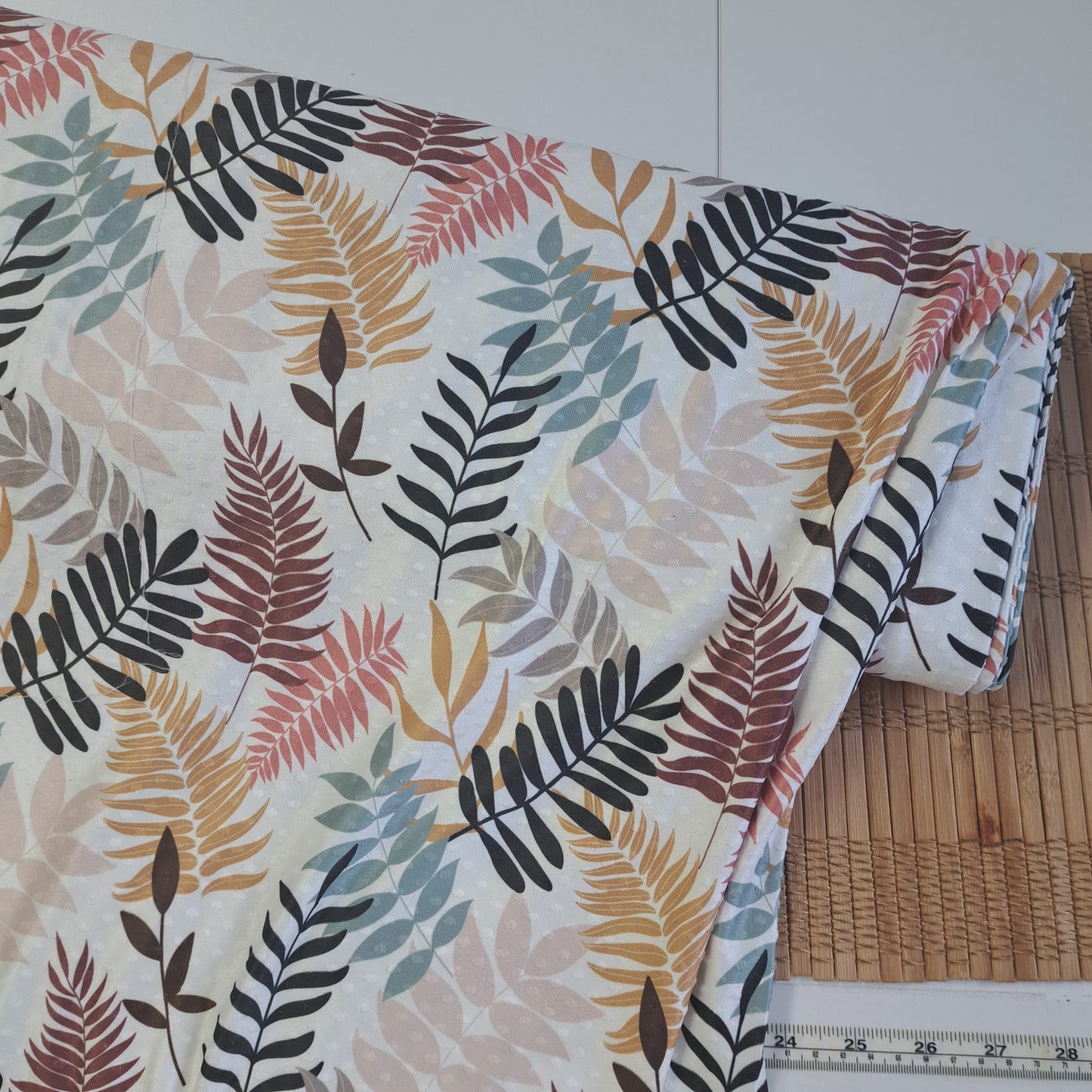 Autumn leaves, Swiss dot knit, SOLD BY HALF METERS